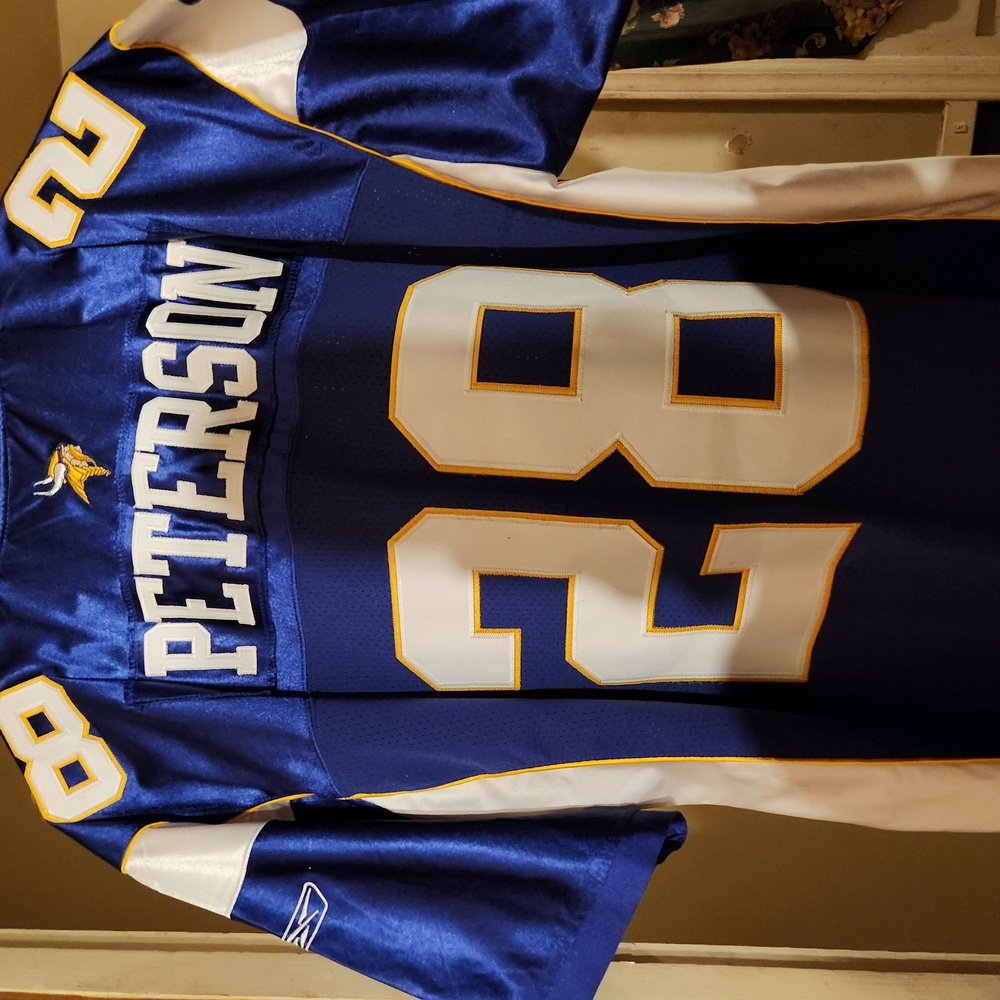 Blue and White Jersey with Number 28